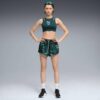 Pantalones cortos de entrenamiento tejidos Green Terrains para mujer