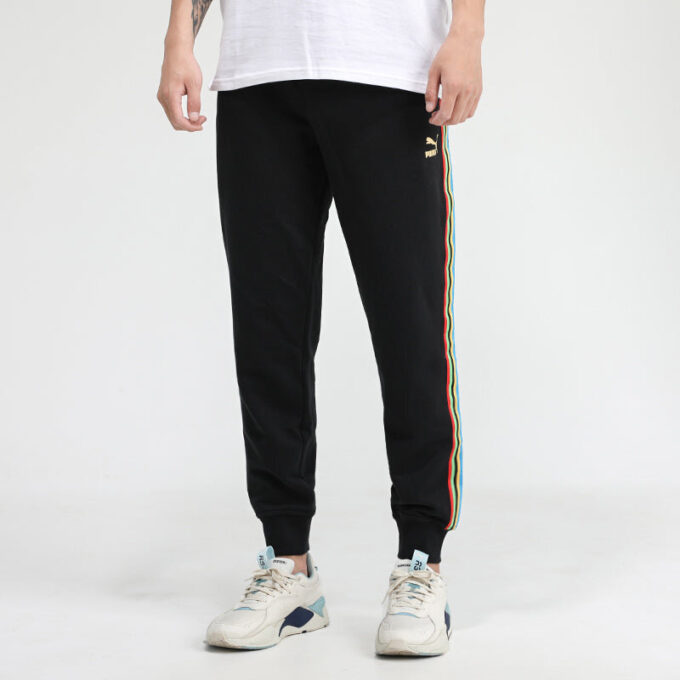 Pantalones deportivos Unity de Tailored For Sport «Negro Naranja»
