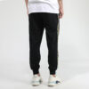Pantalones deportivos Unity de Tailored For Sport «Negro Naranja»
