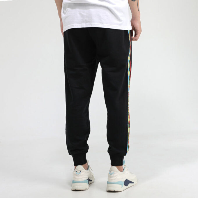 Pantalones deportivos Unity de Tailored For Sport «Negro Naranja»